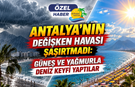 Antalya'nın değişken havası şaşırtmadı: Güneş ve yağmurla deniz keyfi yaptılar