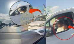 Antalya'da akılalmaz görüntü! Trafikte direksiyonu çocuğa bıraktı!