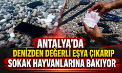 Antalya'da denizden değerli eşya çıkarıp sokak hayvanlarına bakıyor