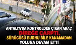 Antalya'da kontrolden çıkan araç direğe çarptı, sürücüsü burnu bile kanamadan yoluna devam etti
