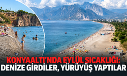 Konyaaltı'nda Eylül sıcaklığı: Denize girdiler, yürüyüş yaptılar
