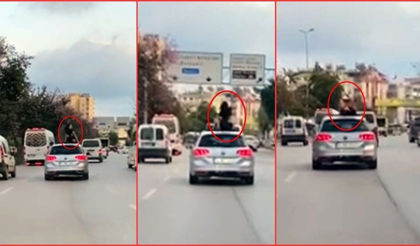 Antalya'da bir kadın aracın üzerinde dans etti! İşte o  anlar
