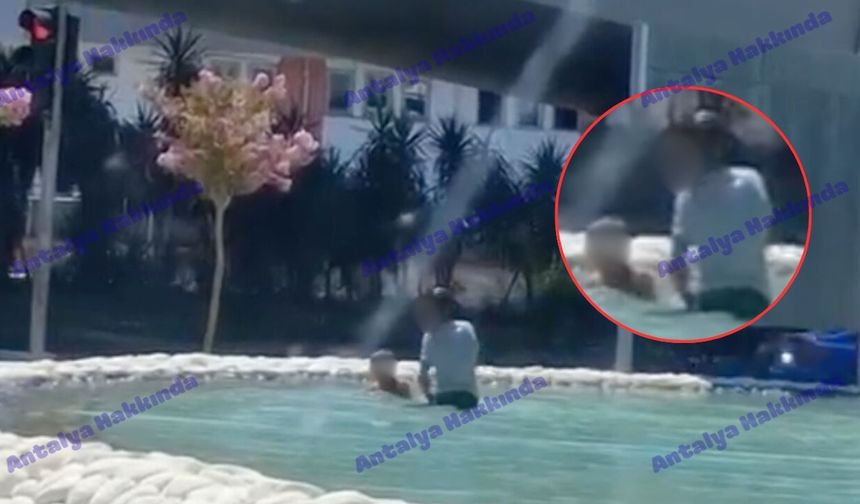 Antalya'da sıcaktan bunalan gençler süs havuzuna girdi!